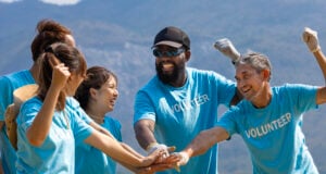 https://www.vecteezy.com/photo/40572255-team-of-young-and-diversity-volunteer-worker-group-enjoy-charitable-social-work-outdoor-together-to-saving-environment-project-wearing-blue-t-shirt-while-joining-hand-in-power-assemble-unity