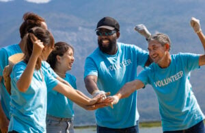 https://www.vecteezy.com/photo/40572255-team-of-young-and-diversity-volunteer-worker-group-enjoy-charitable-social-work-outdoor-together-to-saving-environment-project-wearing-blue-t-shirt-while-joining-hand-in-power-assemble-unity