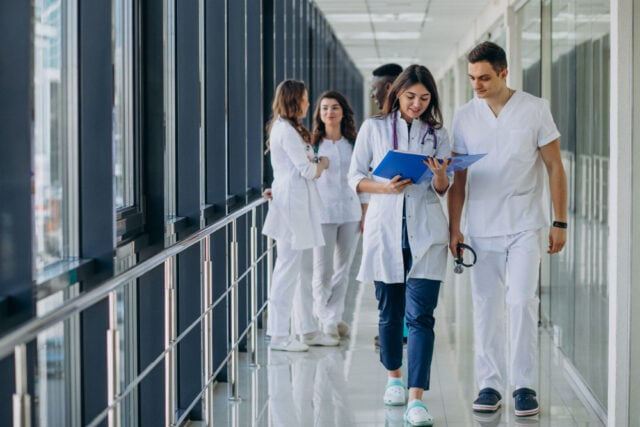 21202 https://www.magnific.com/free-photo/team-young-specialist-doctors-standing-corridor-hospital_7869339.htm#fromView=search&page=1&position=14&uuid=8b12cba7-c37e-4c9c-9b90-98be8205a088&query=medical+center