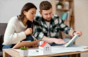 Refinancing A Mortgage: What It Means, How It Works https://www.magnific.com/free-photo/medium-shot-blurry-couple-indoors_12977478.htm#fromView=search&page=1&position=25&uuid=11c3ec77-3c4e-4ad7-9a11-5b4017379b6d&query=mortgage+refinancing