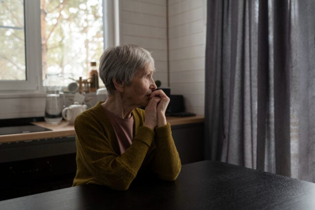 2149390042 https://www.magnific.com/free-photo/medium-shot-senior-woman-sitting-table_25810499.htm#fromView=search&page=2&position=32&uuid=1b544118-09d3-4871-9970-d775f515d357&query=widow