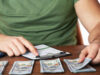 Study Reveals How Much Money You Need to ‘Thrive’ in Today’s Economy https://www.magnific.com/premium-photo/man-working-financial-report-office-closeup_40436809.htm#fromView=search&page=3&position=39&uuid=3e9d7c8f-217a-4b60-a63e-e3d99dc45cd0&query=countig+out+money+to+pay+a+bill