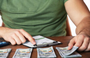 Study Reveals How Much Money You Need to ‘Thrive’ in Today’s Economy https://www.magnific.com/premium-photo/man-working-financial-report-office-closeup_40436809.htm#fromView=search&page=3&position=39&uuid=3e9d7c8f-217a-4b60-a63e-e3d99dc45cd0&query=countig+out+money+to+pay+a+bill