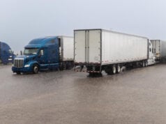 https://www.magnific.com/premium-photo/two-trucks-are-driving-road-with-word-highway-side_47091373.htm#fromView=search&page=1&position=46&uuid=777fdc3f-0a21-4459-ac2d-a06286eab6c9&query=18-wheeler+parked