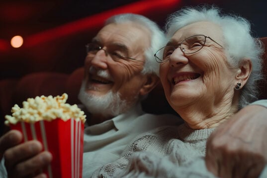 https://www.vecteezy.com/photo/58531165-an-elderly-couple-sitting-in-a-theater-with-popcorn