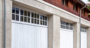 https://www.vecteezy.com/photo/72517857-bern-switzerland-three-white-garage-doors-with-wooden-accents-set-against-a-textured-concrete-wall-showcasing-modern-architecture-and-design-elements-in-a-residential-environment