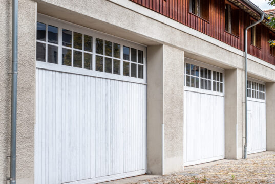 https://www.vecteezy.com/photo/72517857-bern-switzerland-three-white-garage-doors-with-wooden-accents-set-against-a-textured-concrete-wall-showcasing-modern-architecture-and-design-elements-in-a-residential-environment