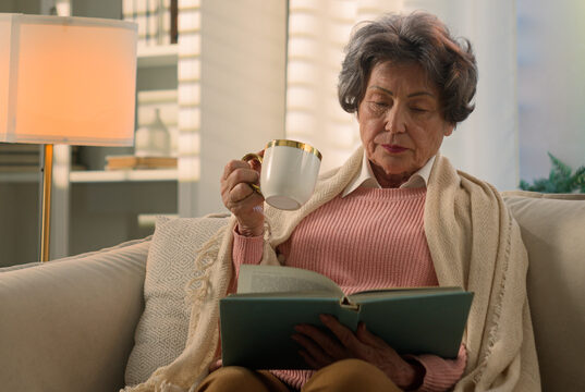 https://www.vecteezy.com/photo/49976957-calm-serious-caucasian-old-woman-covered-with-blanket-on-sofa-drinking-tea-coffee-with-cup-reading-book-senior-mature-lady-elderly-female-retired-pensioner-grandmother-read-novel-drink-at-home-couch