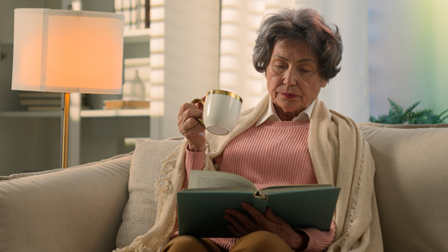 https://www.vecteezy.com/photo/49976957-calm-serious-caucasian-old-woman-covered-with-blanket-on-sofa-drinking-tea-coffee-with-cup-reading-book-senior-mature-lady-elderly-female-retired-pensioner-grandmother-read-novel-drink-at-home-couch