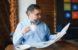 https://www.vecteezy.com/photo/39336651-closeup-portrait-of-serious-senior-handsome-man-reading-newspaper-having-coffee-break-and-sitting-at-table