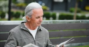 Florida Newspaper Front Pages https://www.vecteezy.com/photo/45671429-portrait-of-senior-man-reading-on-bench-during-summer-day