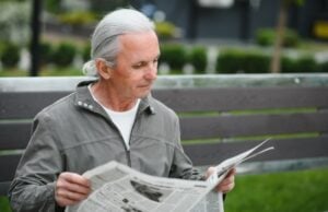Florida Newspaper Front Pages https://www.vecteezy.com/photo/45671429-portrait-of-senior-man-reading-on-bench-during-summer-day