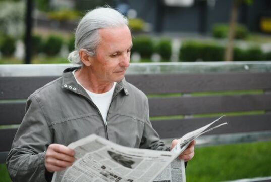 https://www.vecteezy.com/photo/45671429-portrait-of-senior-man-reading-on-bench-during-summer-day