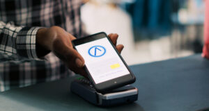 https://www.vecteezy.com/photo/39434353-african-american-man-putting-mobile-phone-on-pos-terminal-paying-for-fashionable-clothes-in-boutique-after-discussing-items-material-with-worker-man-standing-at-retail-store-counter-in-clothing-store