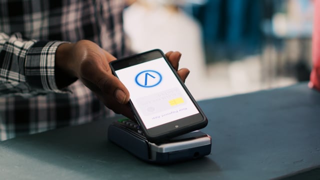 https://www.vecteezy.com/photo/39434353-african-american-man-putting-mobile-phone-on-pos-terminal-paying-for-fashionable-clothes-in-boutique-after-discussing-items-material-with-worker-man-standing-at-retail-store-counter-in-clothing-store