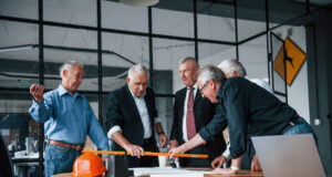 Retirement Rewritten: How Older Americans Are Redefining Work and Financial Security https://www.vecteezy.com/photo/15241822-aged-team-of-elderly-businessman-architects-works-with-plan-in-the-office
