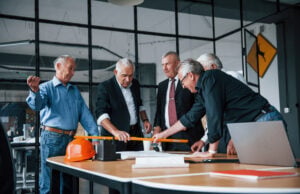 Retirement Rewritten: How Older Americans Are Redefining Work and Financial Security https://www.vecteezy.com/photo/15241822-aged-team-of-elderly-businessman-architects-works-with-plan-in-the-office