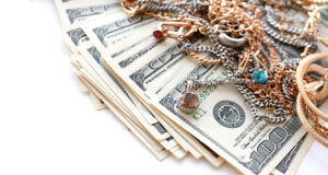 https://www.vecteezy.com/photo/12304726-many-expensive-golden-and-silver-jewerly-rings-earrings-and-necklaces-with-big-amount-of-us-dollar-bills-on-white-background-pawnshop-or-jewerly-shop