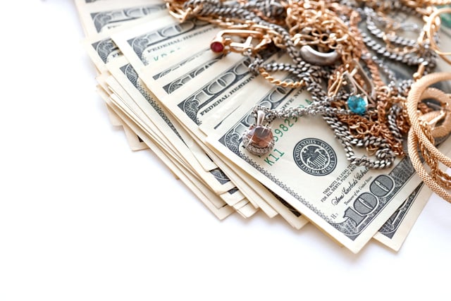 https://www.vecteezy.com/photo/12304726-many-expensive-golden-and-silver-jewerly-rings-earrings-and-necklaces-with-big-amount-of-us-dollar-bills-on-white-background-pawnshop-or-jewerly-shop