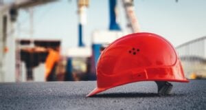 https://unsplash.com/photos/red-hard-hat-on-pavement-9OB46apMbC4