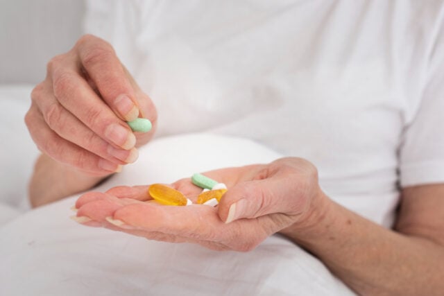 2148341469 https://www.magnific.com/free-photo/person-holding-many-colorful-pills_5943405.htm#fromView=search&page=1&position=30&uuid=514fe62b-9e29-43db-9cc0-4917723c0173&track=ais_hybrid&query=senior+taking+pills