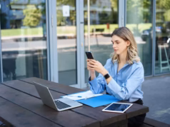 https://img.magnific.com/free-photo/portrait-businesswoman-sitting-outdoors-working-young-corporate-woman-looking-her-smartpho_1258-117494.jpg?semt=ais_hybrid&w=740&q=80