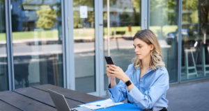 https://img.magnific.com/free-photo/portrait-businesswoman-sitting-outdoors-working-young-corporate-woman-looking-her-smartpho_1258-117494.jpg?semt=ais_hybrid&w=740&q=80