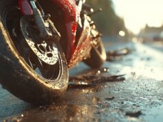 https://www.vecteezy.com/photo/55579264-a-red-motorcycle-rests-on-the-ground-surrounded-by-debris-on-a-wet-road-at-sunset