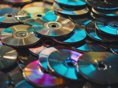 Guess Who’s Back: Why We’re All Falling in Love With CDs Again https://www.vecteezy.com/photo/49218414-colorful-stack-of-cds-in-a-chaotic-pile