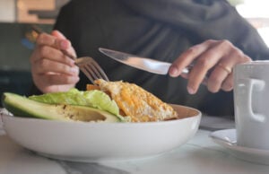 https://www.vecteezy.com/photo/69746356-enjoying-a-flavorful-dish-featuring-cheese-avocado-and-greens-in-a-cafe