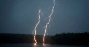 Fatal Florida Lightning Incident Highlights How Quickly a Lightning Threat Can Develop (Video) https://www.vecteezy.com/photo/72919060-two-powerful-lightning-bolts-strike-a-dark-lake-reflecting-light-against-a-dense-forest-at-night