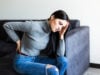 https://www.magnific.com/free-photo/young-woman-suffering-back-ache-complaining-sitting-couch-living-room-home_8472695.htm#fromView=search&page=1&position=0&uuid=67fb06e7-e588-4c23-b12c-8d6b56c231fb&track=ais_hybrid&query=woman+sitting+in+pain