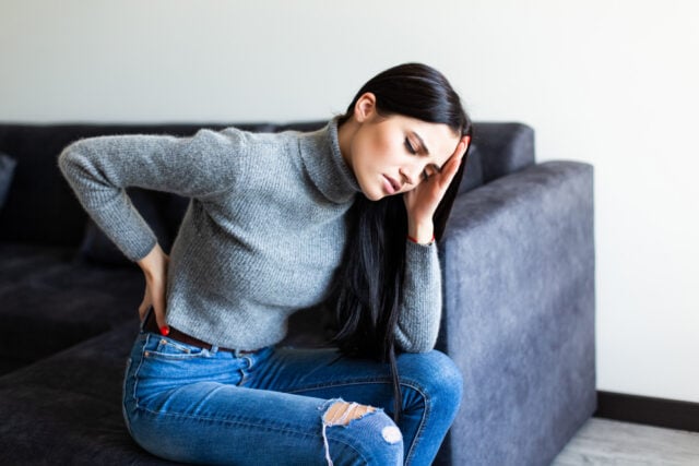 https://www.magnific.com/free-photo/young-woman-suffering-back-ache-complaining-sitting-couch-living-room-home_8472695.htm#fromView=search&page=1&position=0&uuid=67fb06e7-e588-4c23-b12c-8d6b56c231fb&track=ais_hybrid&query=woman+sitting+in+pain