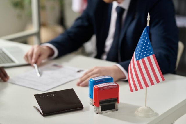 5671 https://www.magnific.com/premium-photo/close-up-approved-rejected-stamps-table-us-immigration-office-with-flag-copy-space_35636533.htm#fromView=search&page=1&position=17&uuid=9c0e4cf2-a542-4223-91fe-12a8d4d60f5f&track=ais_hybrid&query=E-1+Visa+lawyer