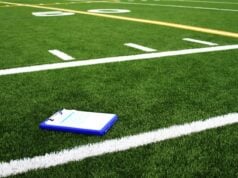 https://unsplash.com/photos/a-notebook-sitting-on-the-side-of-a-football-field-Rn6n5Lh1BdA?utm_source=unsplash&utm_medium=referral&utm_content=creditCopyText