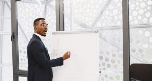 https://www.pexels.com/photo/businessman-presenting-on-a-flipchart-in-an-office-6285120/