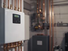 https://www.vecteezy.com/photo/50787087-a-sleek-efficient-tankless-water-heater-is-mounted-on-the-wall-connected-to-organized-copper-pipes-in-a-tidy-basement-utility-room-showcasing-advanced-modern-installation-techniques