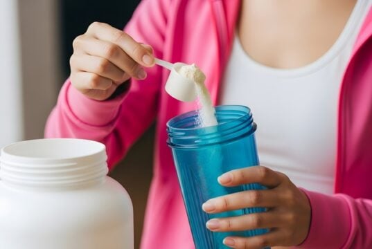 https://www.vecteezy.com/photo/78356895-a-woman-is-holding-a-bottle-of-protein-powder