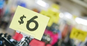 The Hidden Polyester Tax: Why Shoppers Are Paying Premium Prices for Cheap Fabric https://www.vecteezy.com/photo/13944672-close-up-of-sale-sign-in-a-closing-store