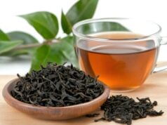How To Brew Premium Oolong Tea for Flavor https://www.vecteezy.com/photo/59892440-dried-tea-leaves-resting-in-small-wooden-bowl-near-cup-of-tea