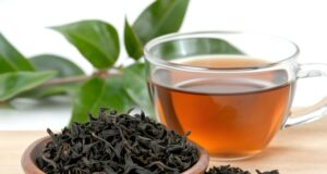 https://www.vecteezy.com/photo/59892440-dried-tea-leaves-resting-in-small-wooden-bowl-near-cup-of-tea