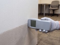 What Factors Determine a Fair Lead Paint Settlement in New York? https://www.vecteezy.com/photo/87383463-gloved-hand-checking-wall-dampness-with-meter