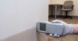 https://www.vecteezy.com/photo/87383463-gloved-hand-checking-wall-dampness-with-meter