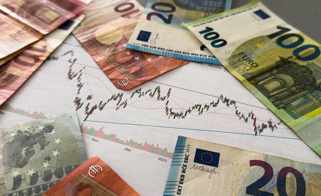 The concept of the fall and growth of the euro exchange rate. One hundred euro on a blue chart background. https://www.vecteezy.com/photo/87617101-the-concept-of-the-fall-and-growth-of-the-euro-exchange-rate-one-hundred-euro-on-a-blue-chart-background